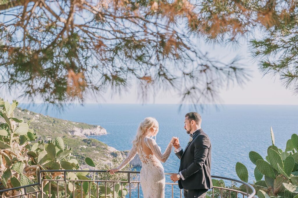 Amidst nature and sea views, a Capri wedding photographer captures a couple sharing a romantic glance