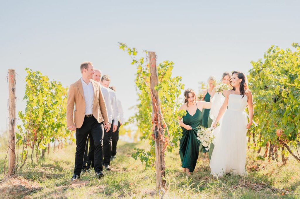 Bride and groom with wedding party, captured by Florence wedding photographer, showing group celebration